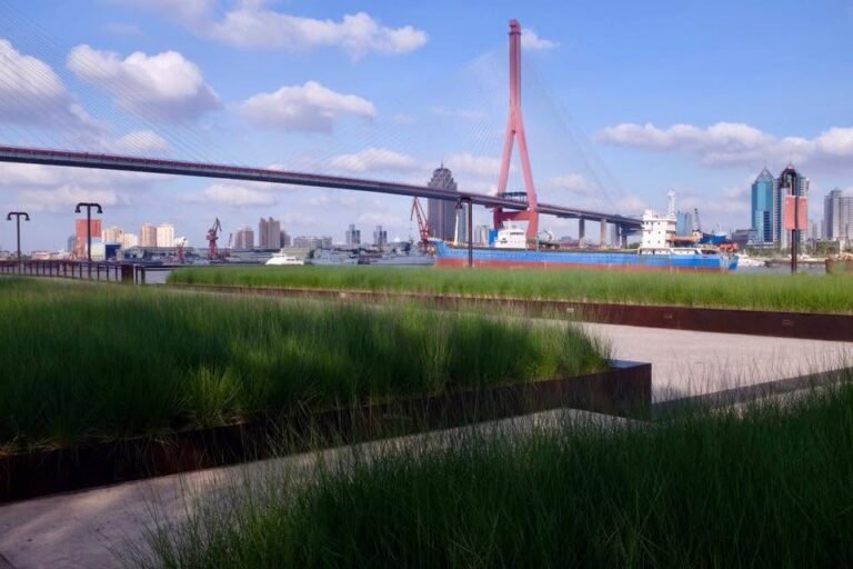 Preserved industrial crane and native grass planting along the Yangpu Waterfront in Shanghai